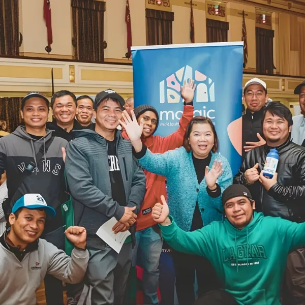 Diverse group of young people celebrating together in a library setting